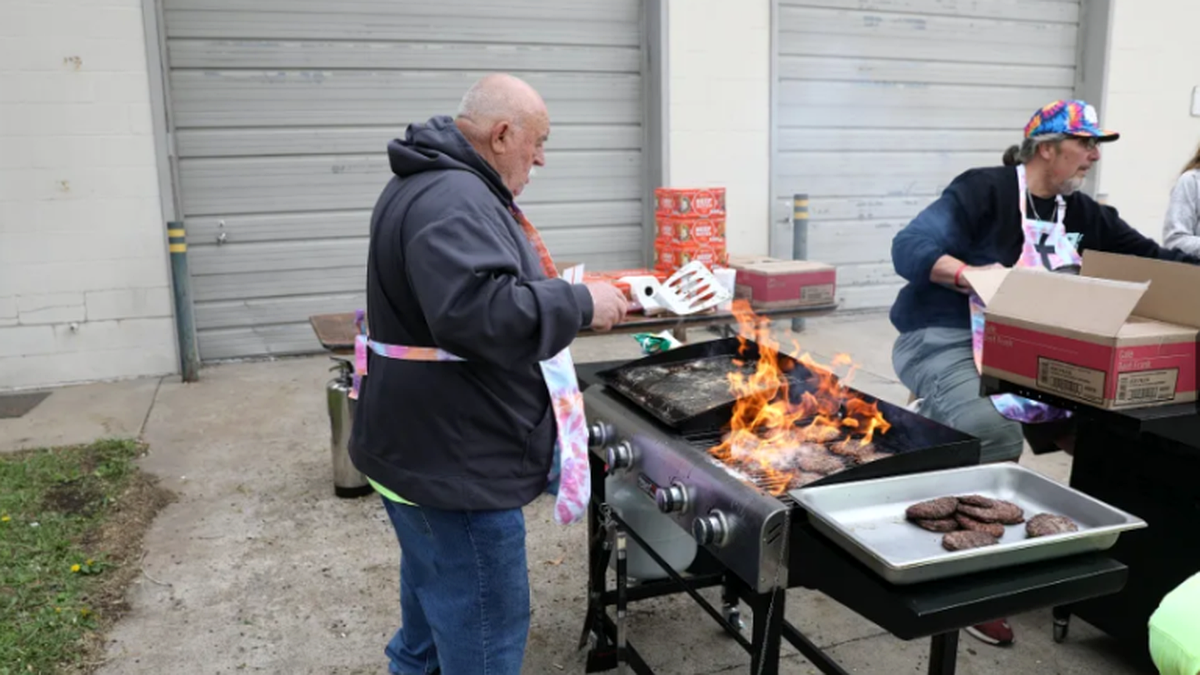 Maranatha Baptist Fellowship members serving food at a local community fall festival